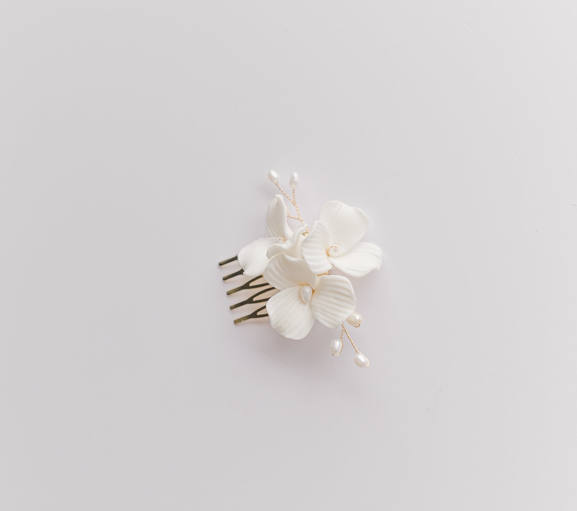 Rose gold bridal hair comb with 3 large porcelain flowers and fresh water pearls