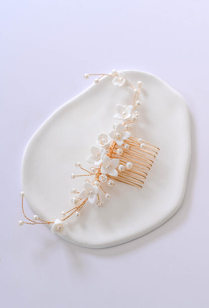 Gold Bridal hair comb with porcelain flowers and faux pearls.
