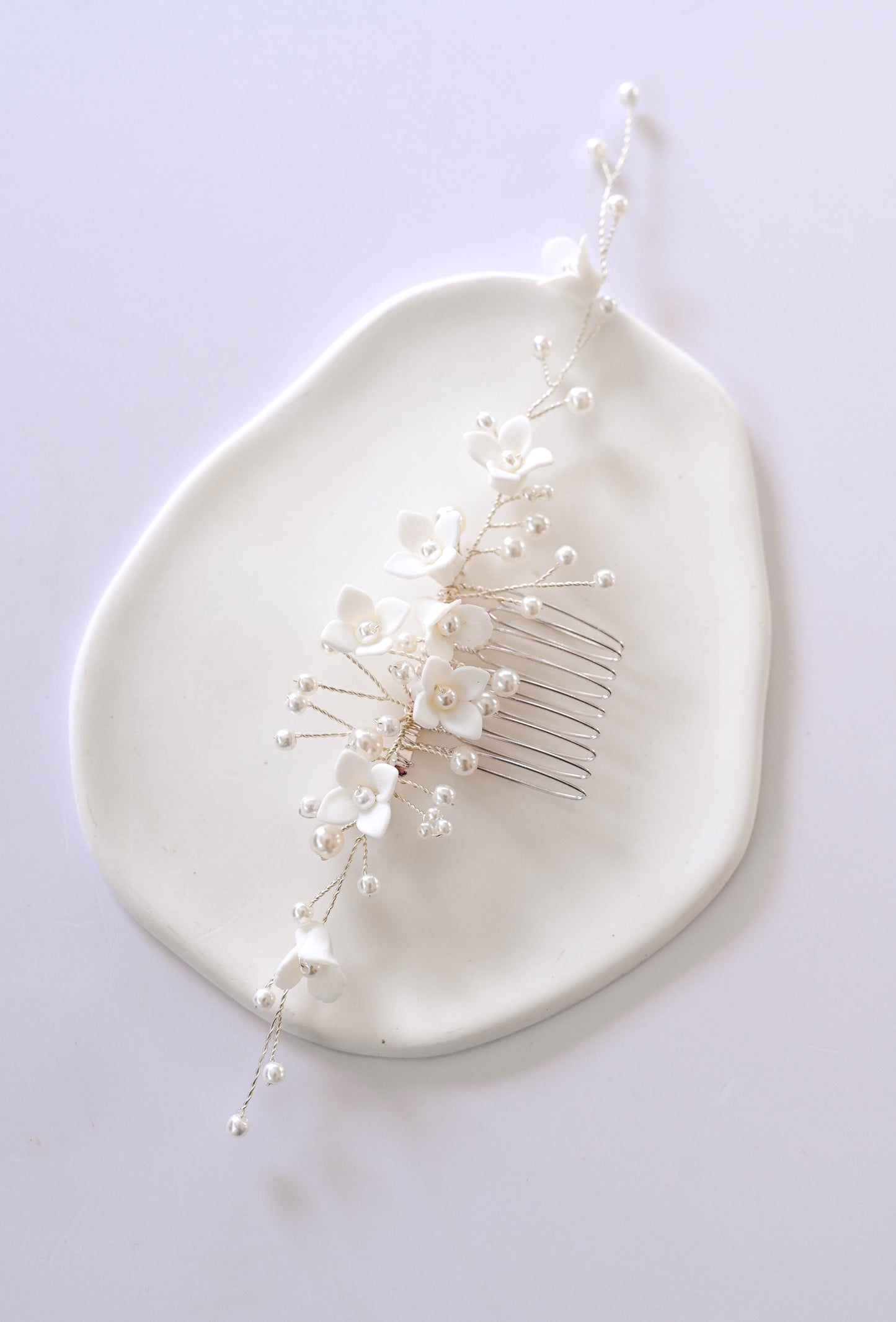 Silver Bridal hair comb with porcelain flowers and faux pearls.