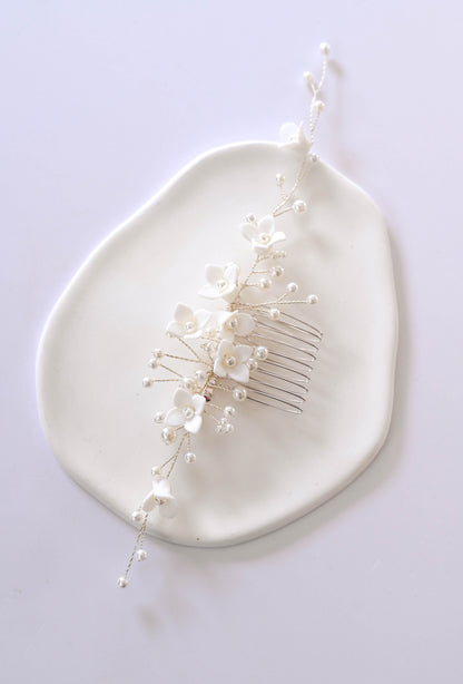 Silver Bridal hair comb with porcelain flowers and faux pearls.