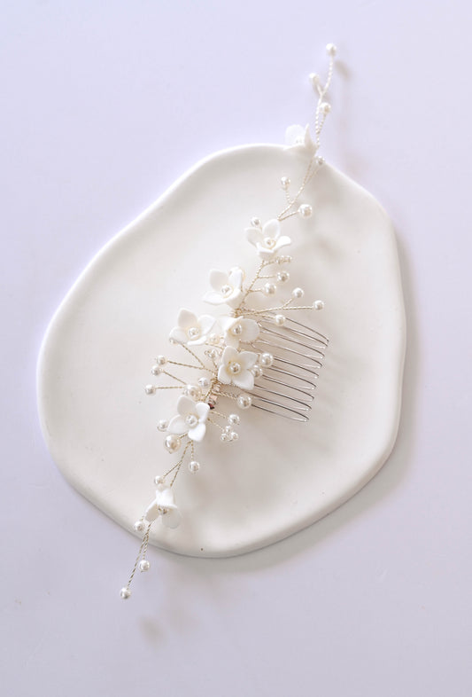 Silver Bridal hair comb with porcelain flowers and faux pearls.