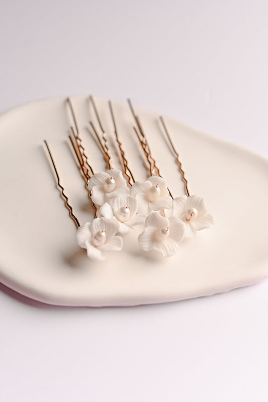 Rose gold bridal pins with porcelain flowers and fresh water pearls