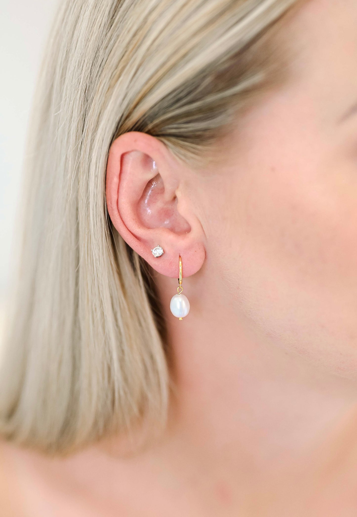 Bride wearing sterling silver hoop earring with a freshwater pearl