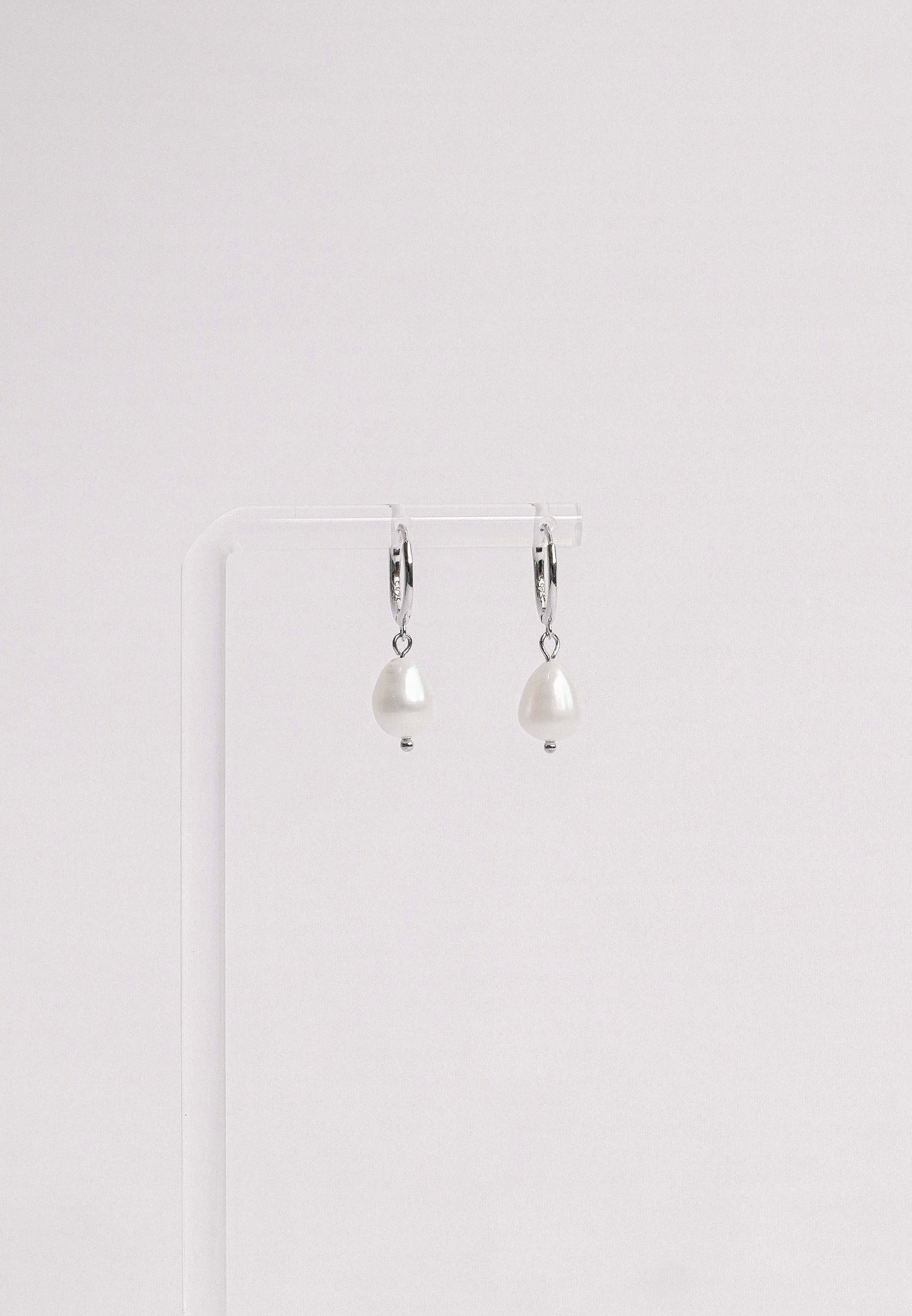 Sterling silver hoop earring with a freshwater pearl
