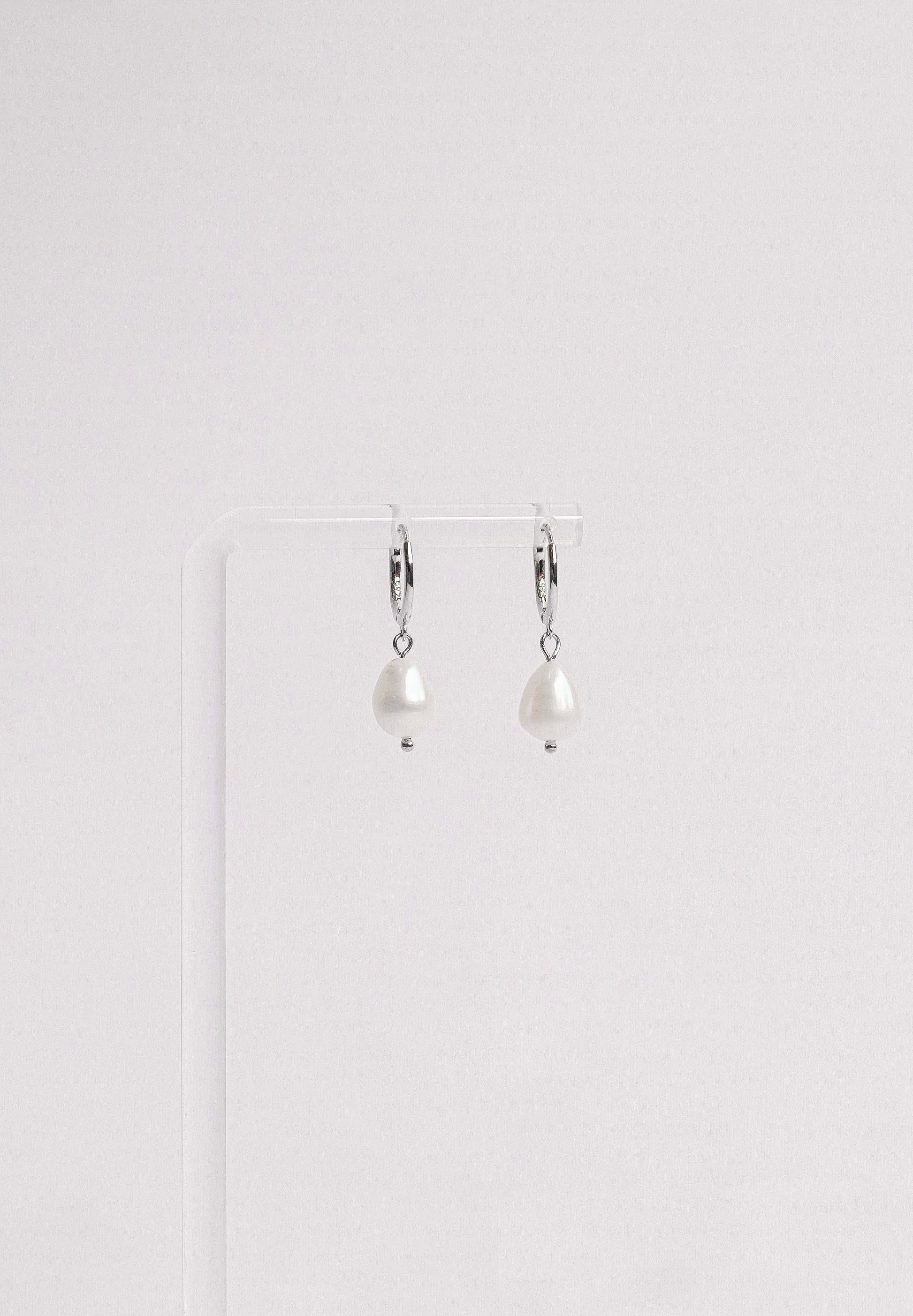 Sterling silver hoop earring with a freshwater pearl