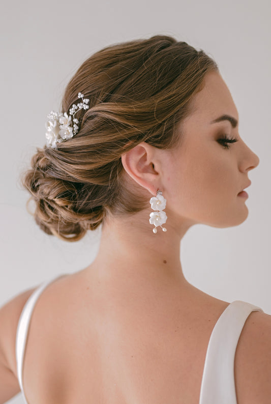 Bride wearing porcelain flower earring with fresh water pearls