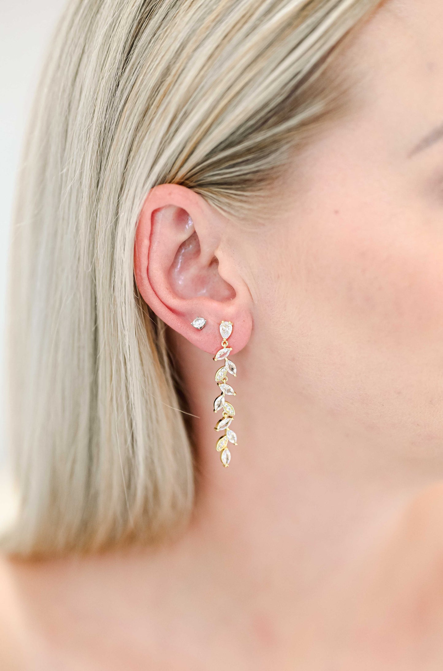 Bride wearing a dangling leaf design earring