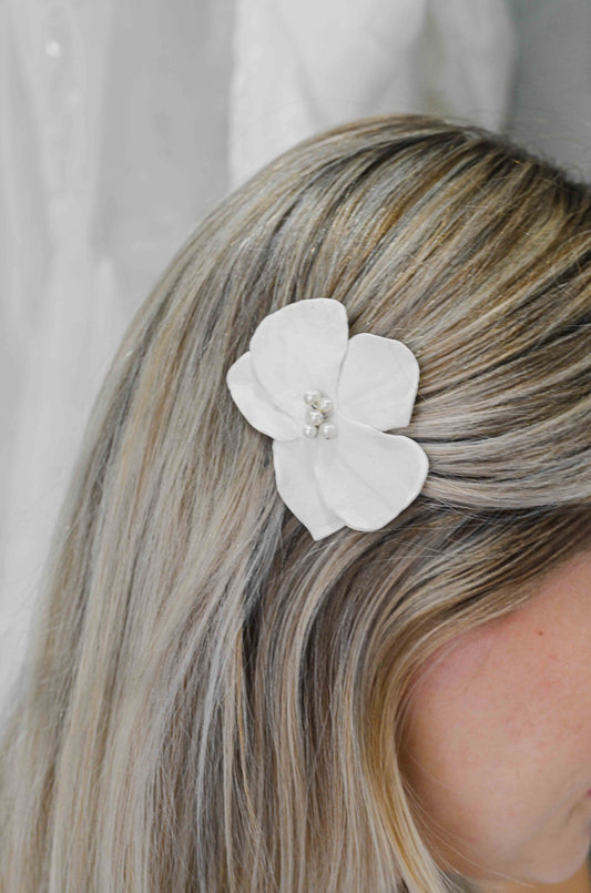 Handmade clay flower pin in hair
