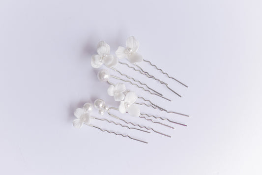 A set of 6 silver hair pins with porcelain flowers and pearls