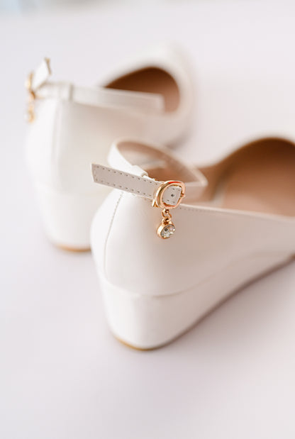 Wedge heel with embellishment  on strap