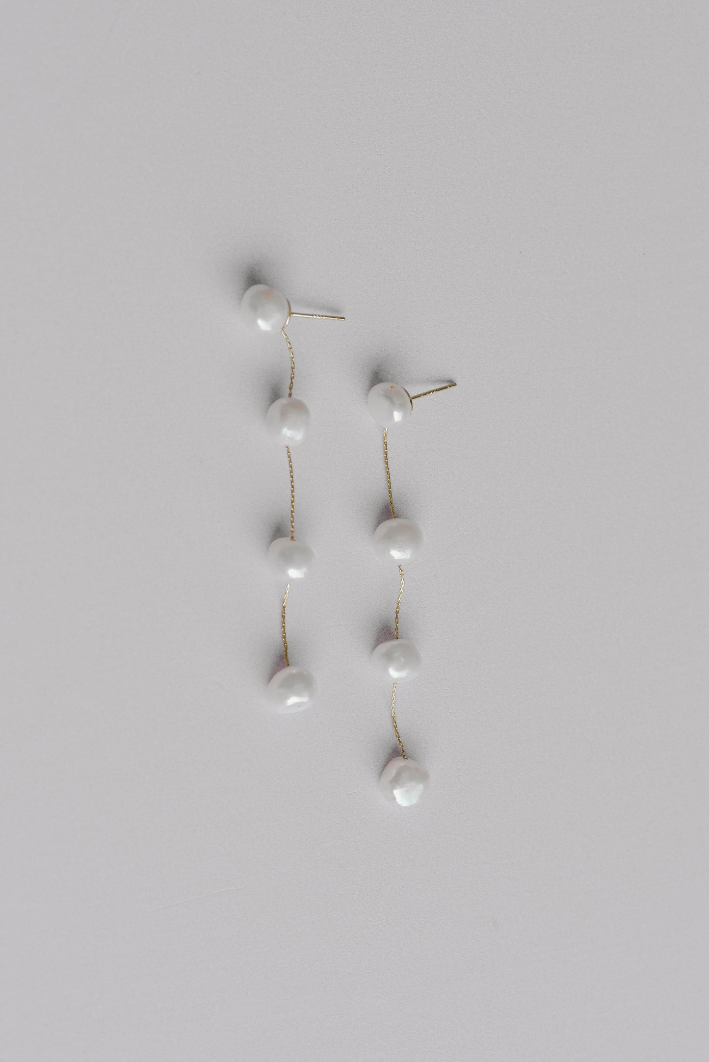 Gold string of 4 fresh water pearl bridal earrings