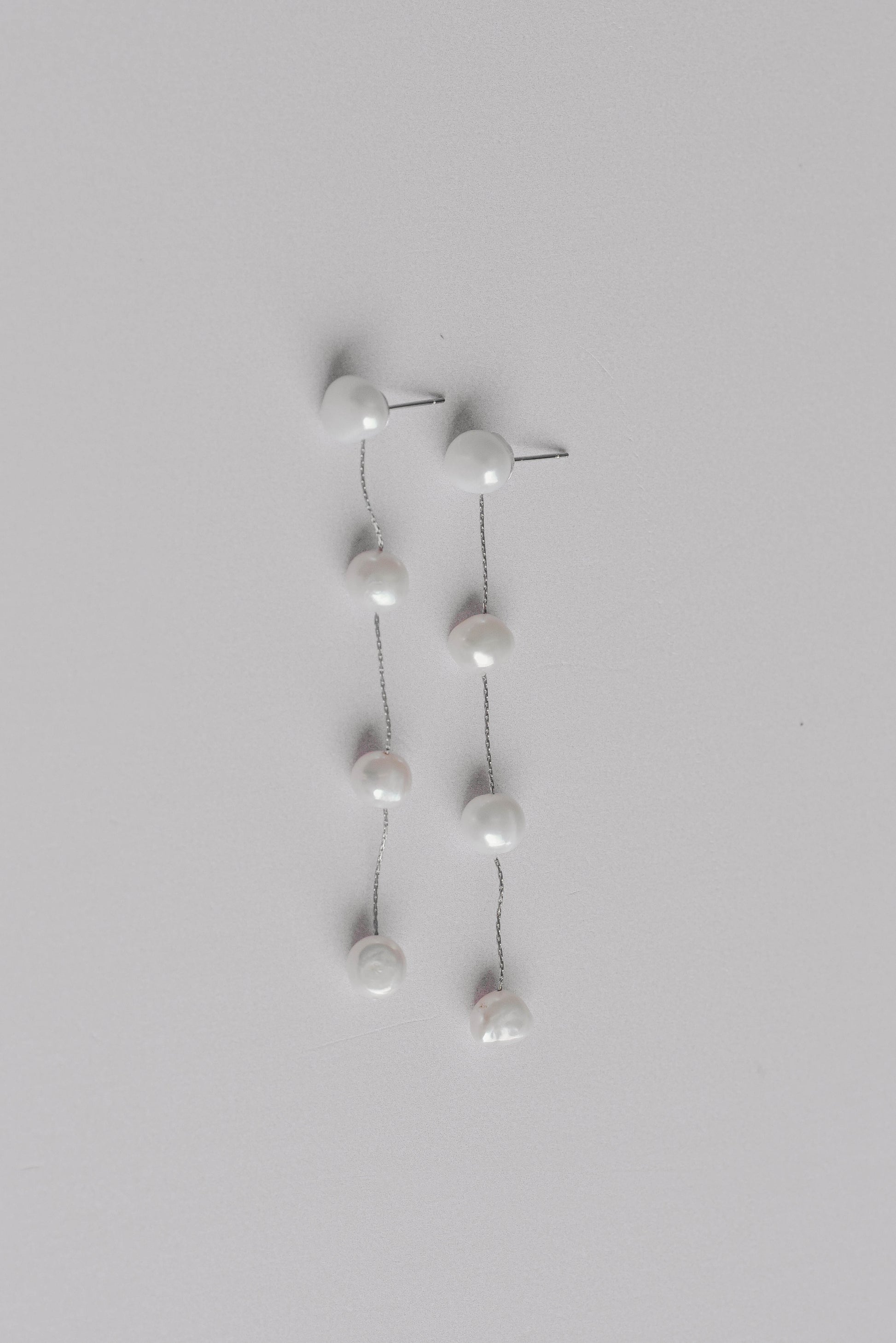 Silver string of 4 fresh water pearl bridal earrings