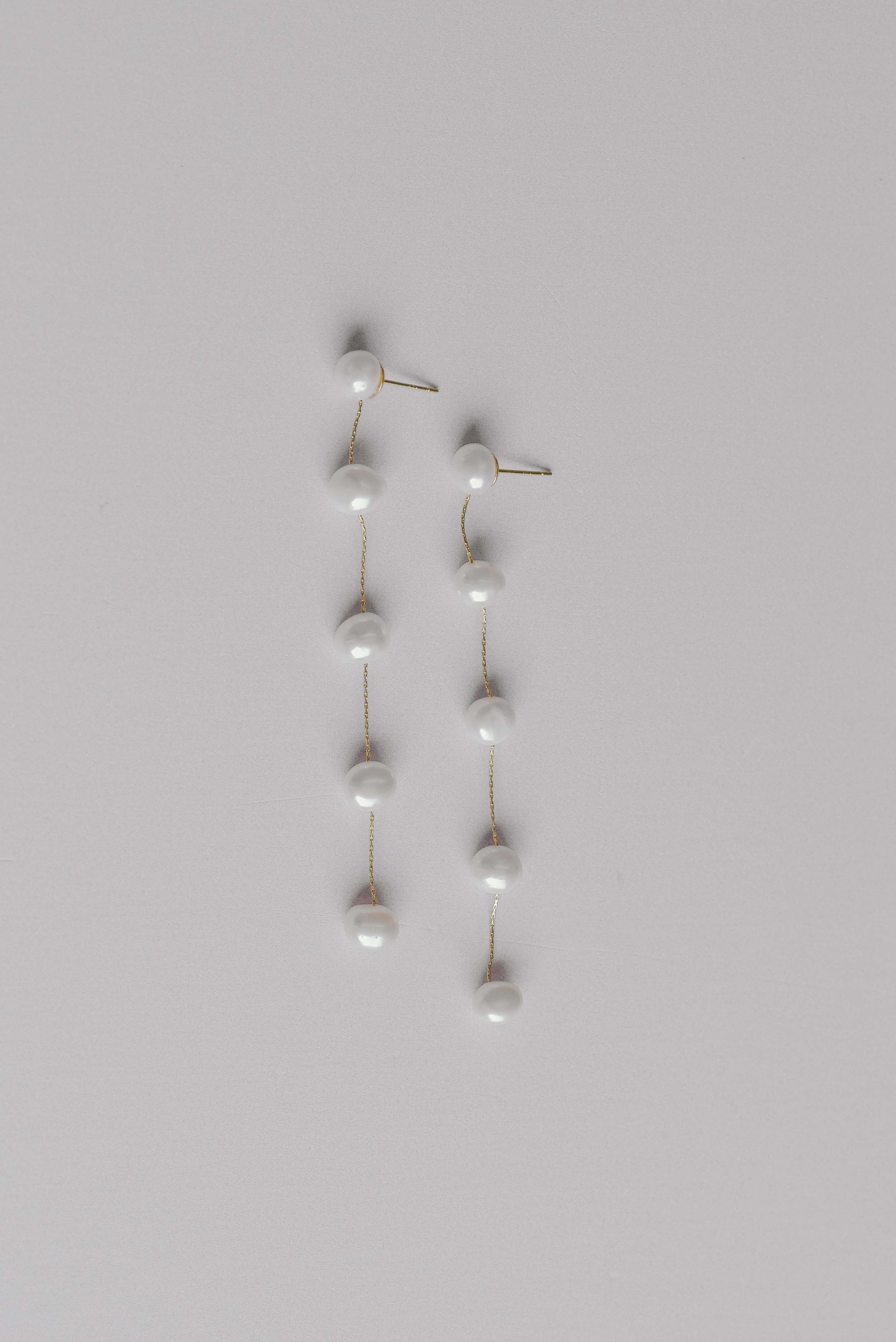 Gold string of 5 fresh water pearl earrings