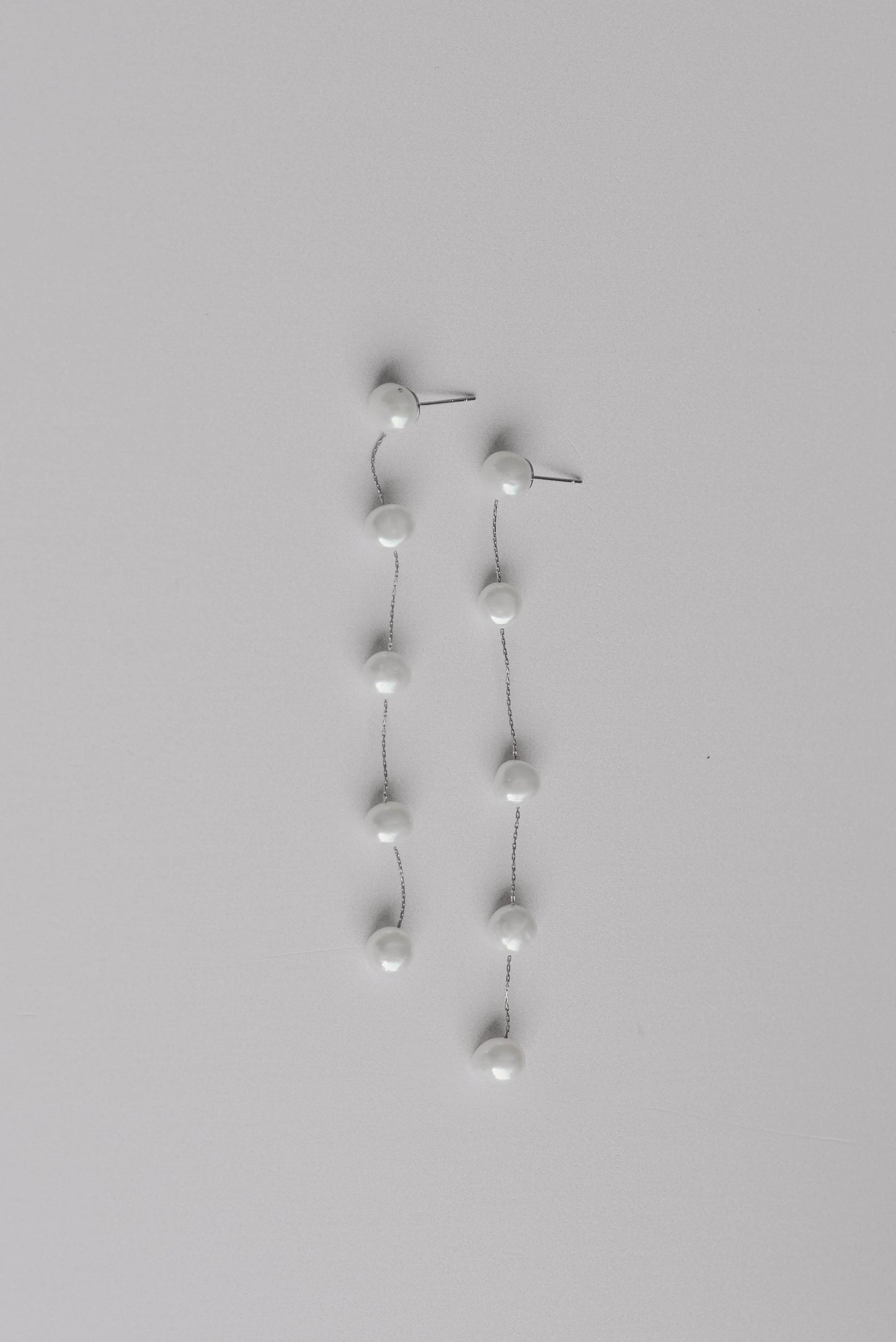 Silver string of 5 fresh water pearl earrings