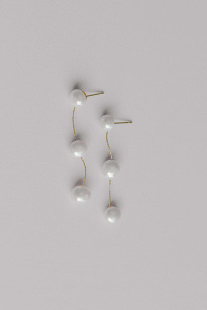 Gold bridal earrings with a string of 3 fresh water pearls