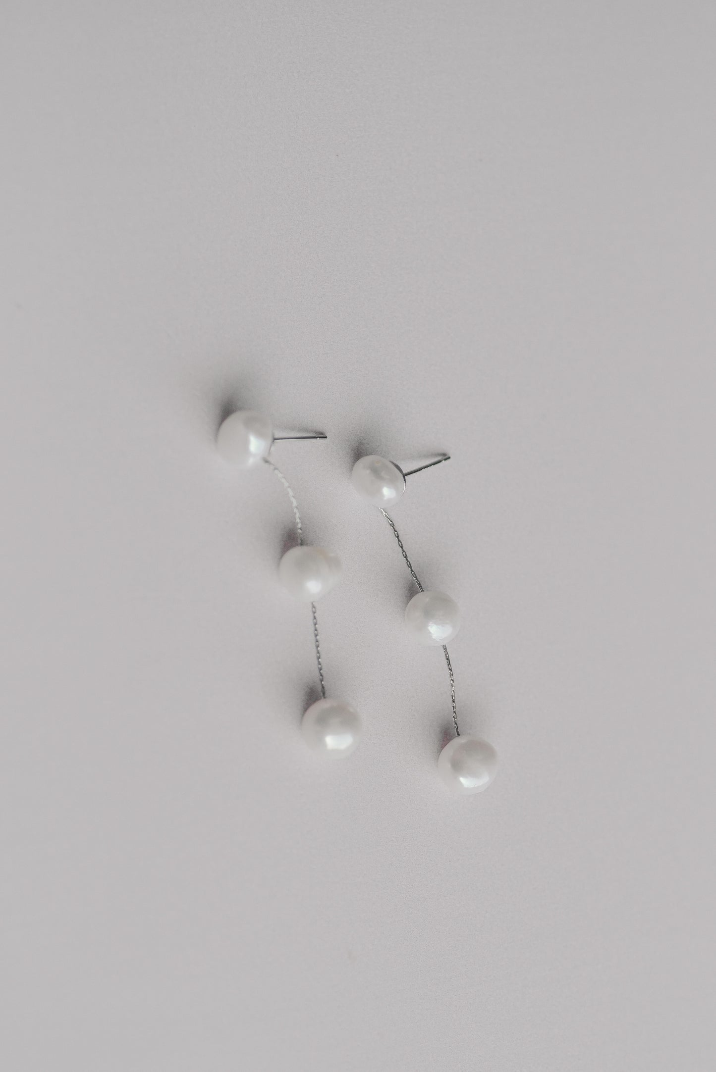 Silver bridal earrings with a string of 3 fresh water pearls