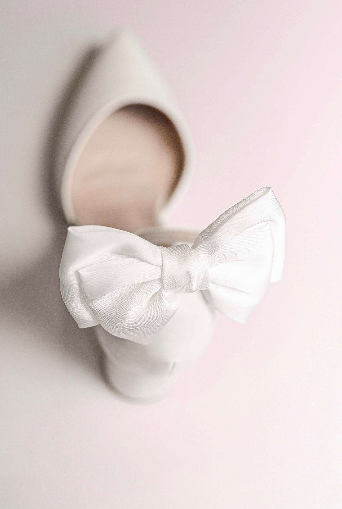 Bridal shoe with satin bow clip at back
