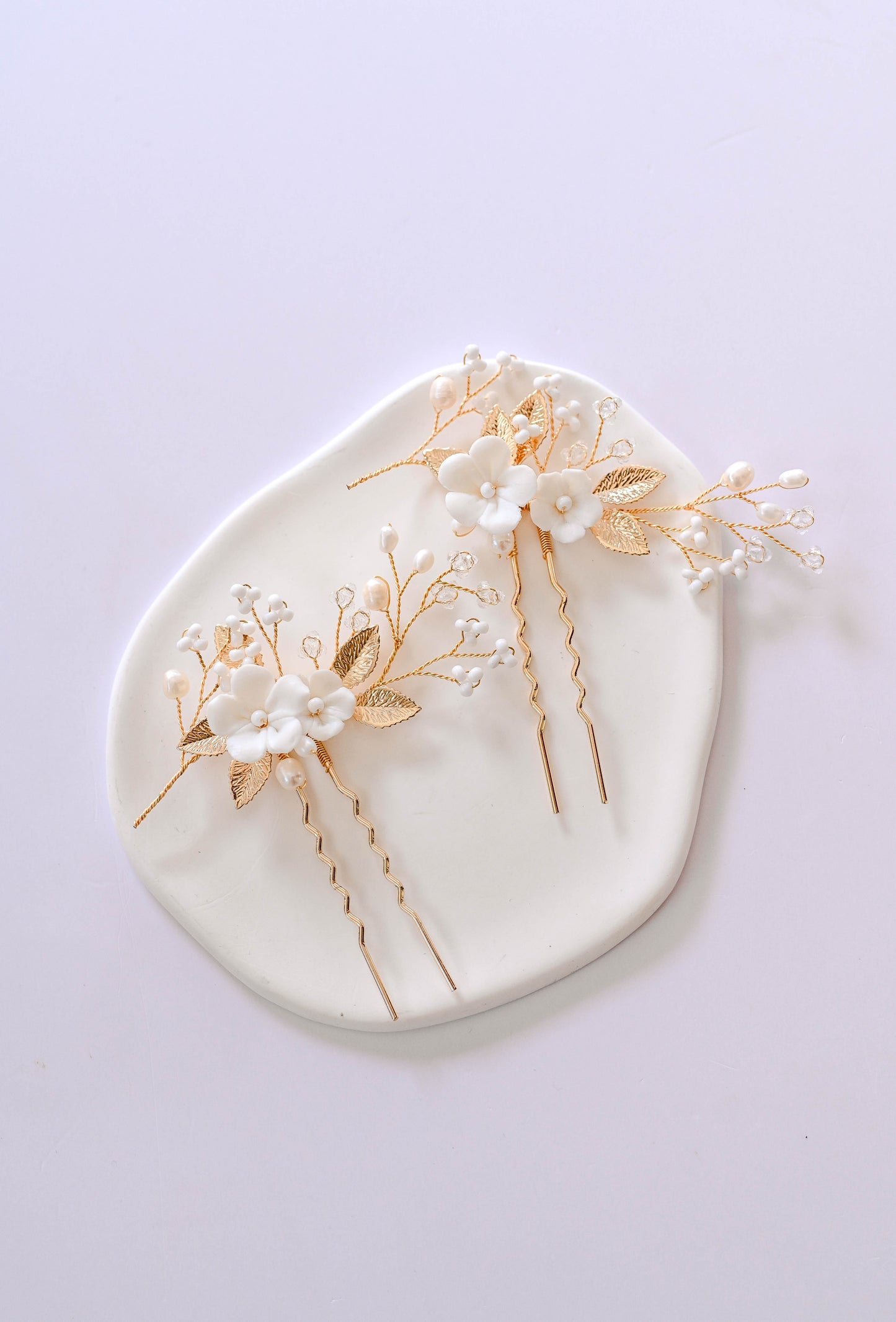 Set of two porcelain flower golden hair pins with freshwater pearls.