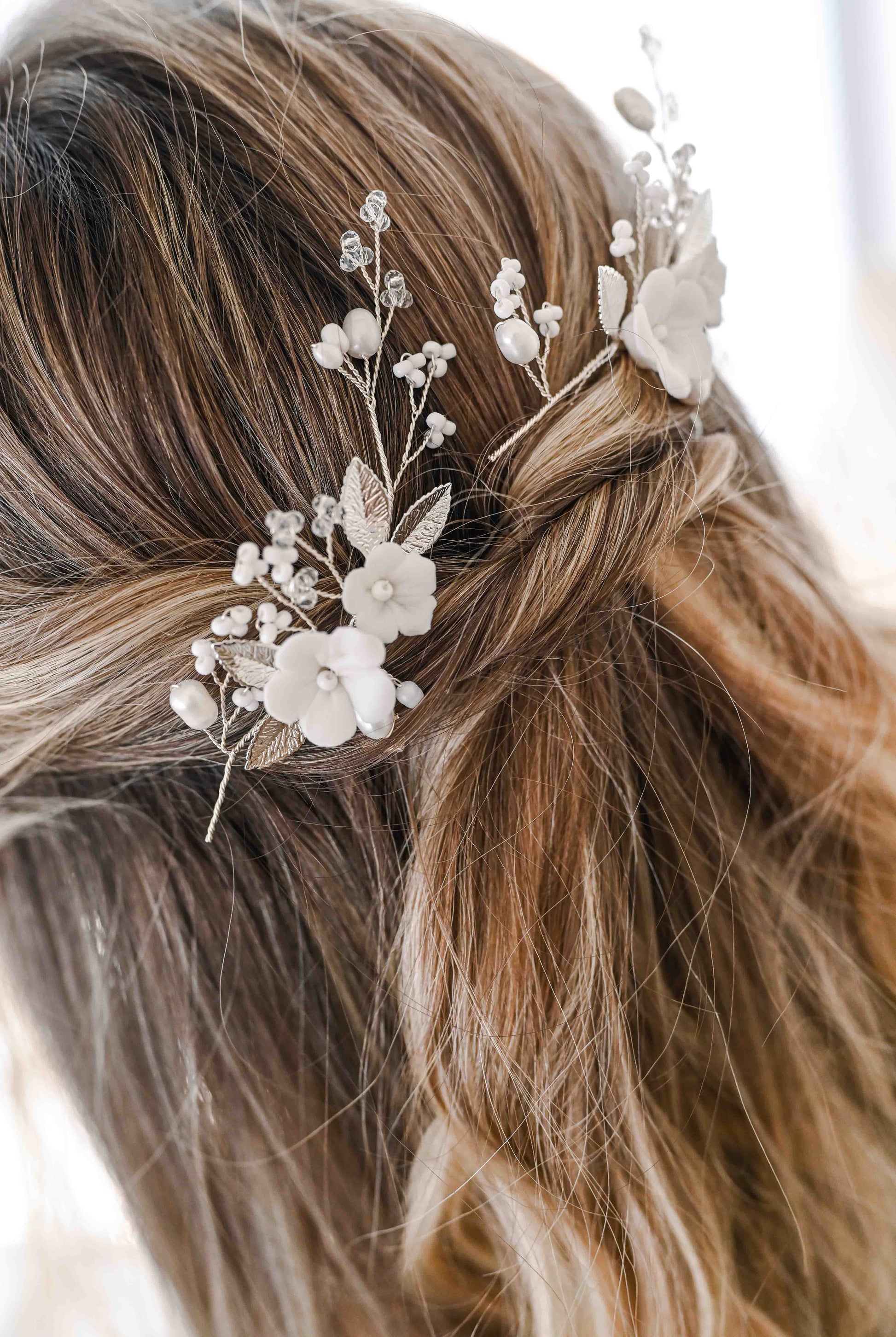 Set of two porcelain flower bridal hair pins with freshwater pearls.