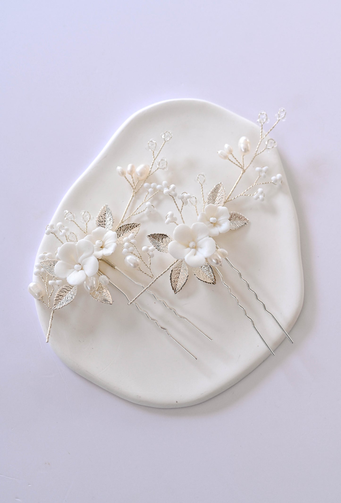 Set of two porcelain flower silver hair pins with freshwater pearls.