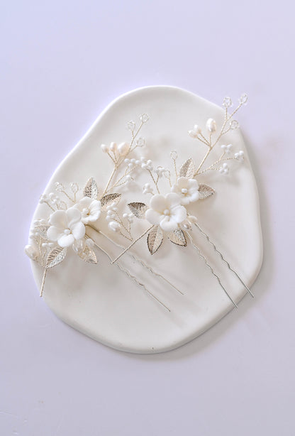 Set of two porcelain flower silver hair pins with freshwater pearls.