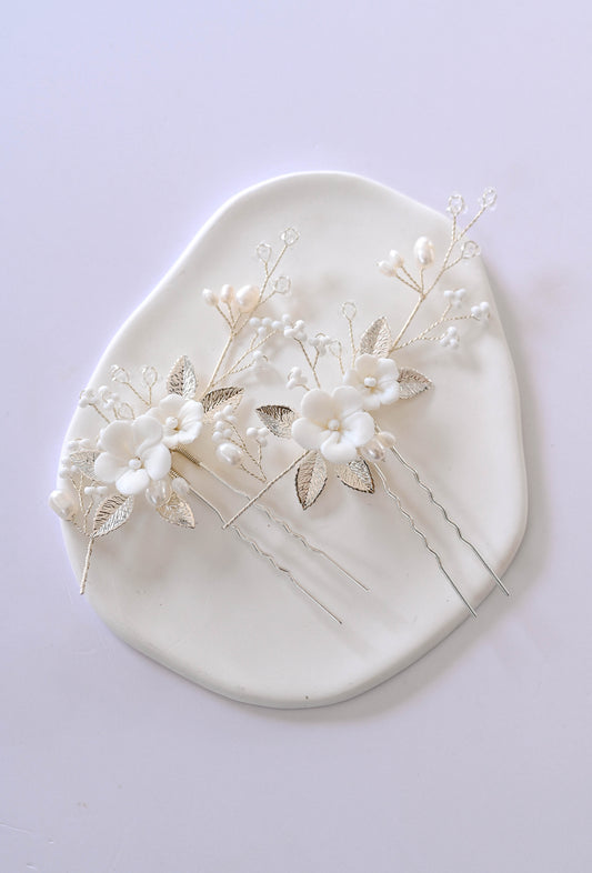Set of two porcelain flower silver hair pins with freshwater pearls.