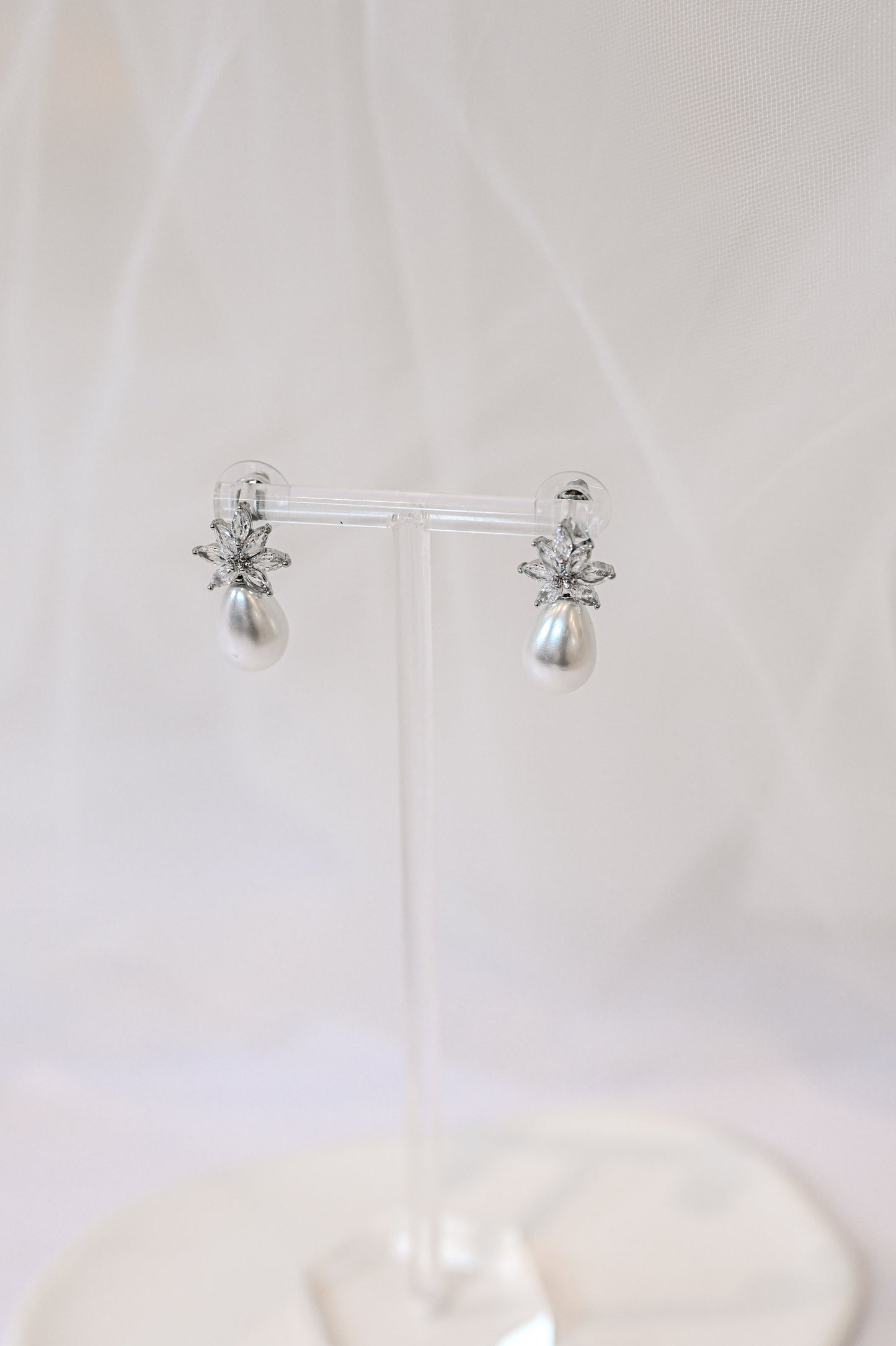 Silver cubic zirconia earrings with a teardrop pearl