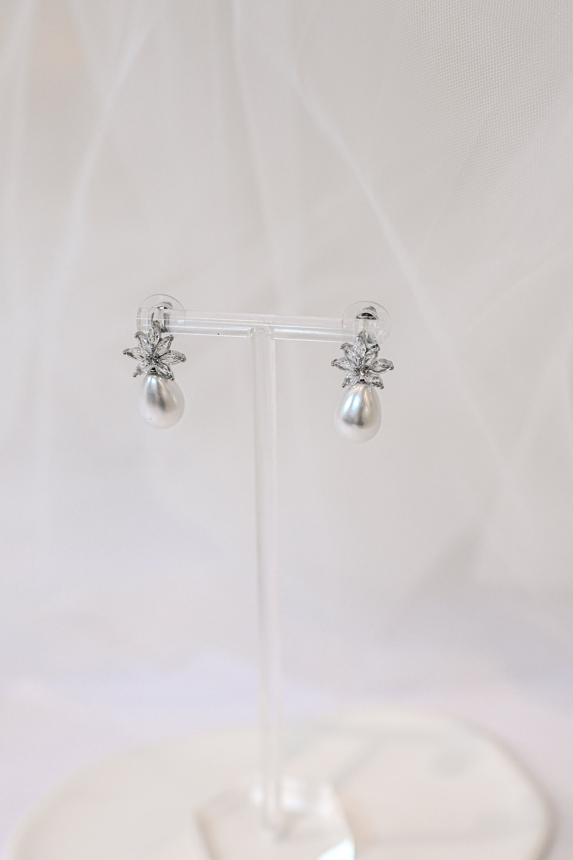 Silver cubic zirconia earrings with a teardrop pearl