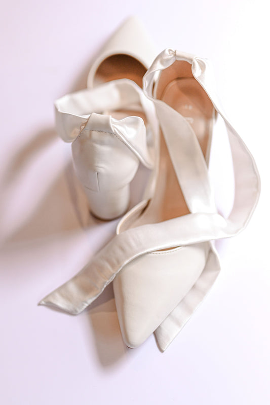 Ivory closed toe bridal block heel with satin strap to tie bow