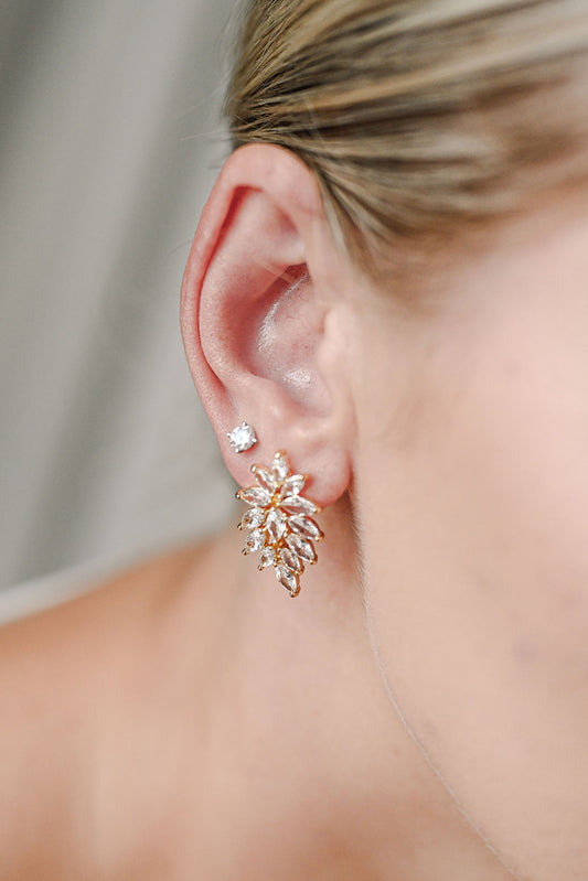 Woman wearing gold bridal earring stud