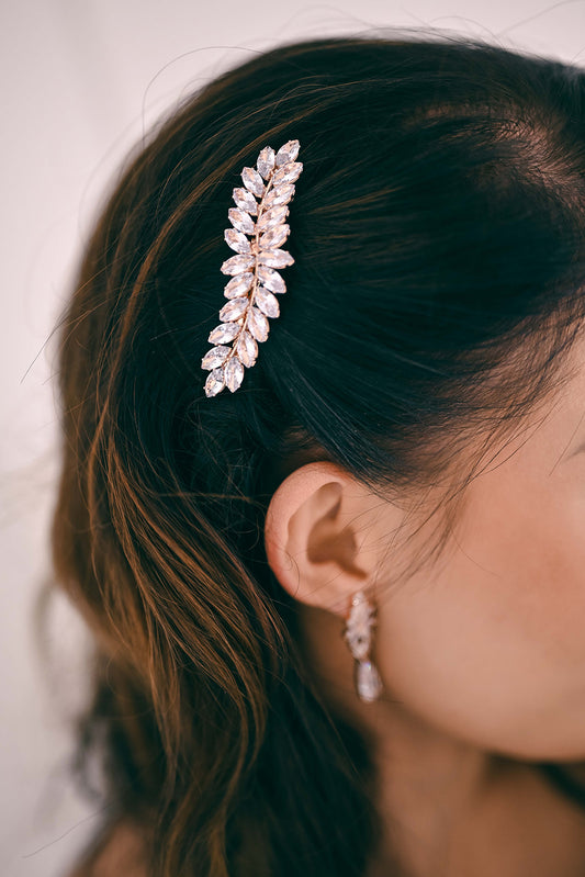 Bride wearing a rose gold crystal hair accessory