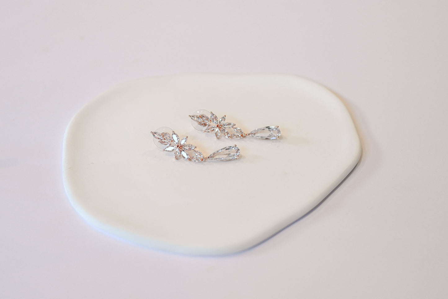 Rose gold cubic zirconia dangling bridal earrings