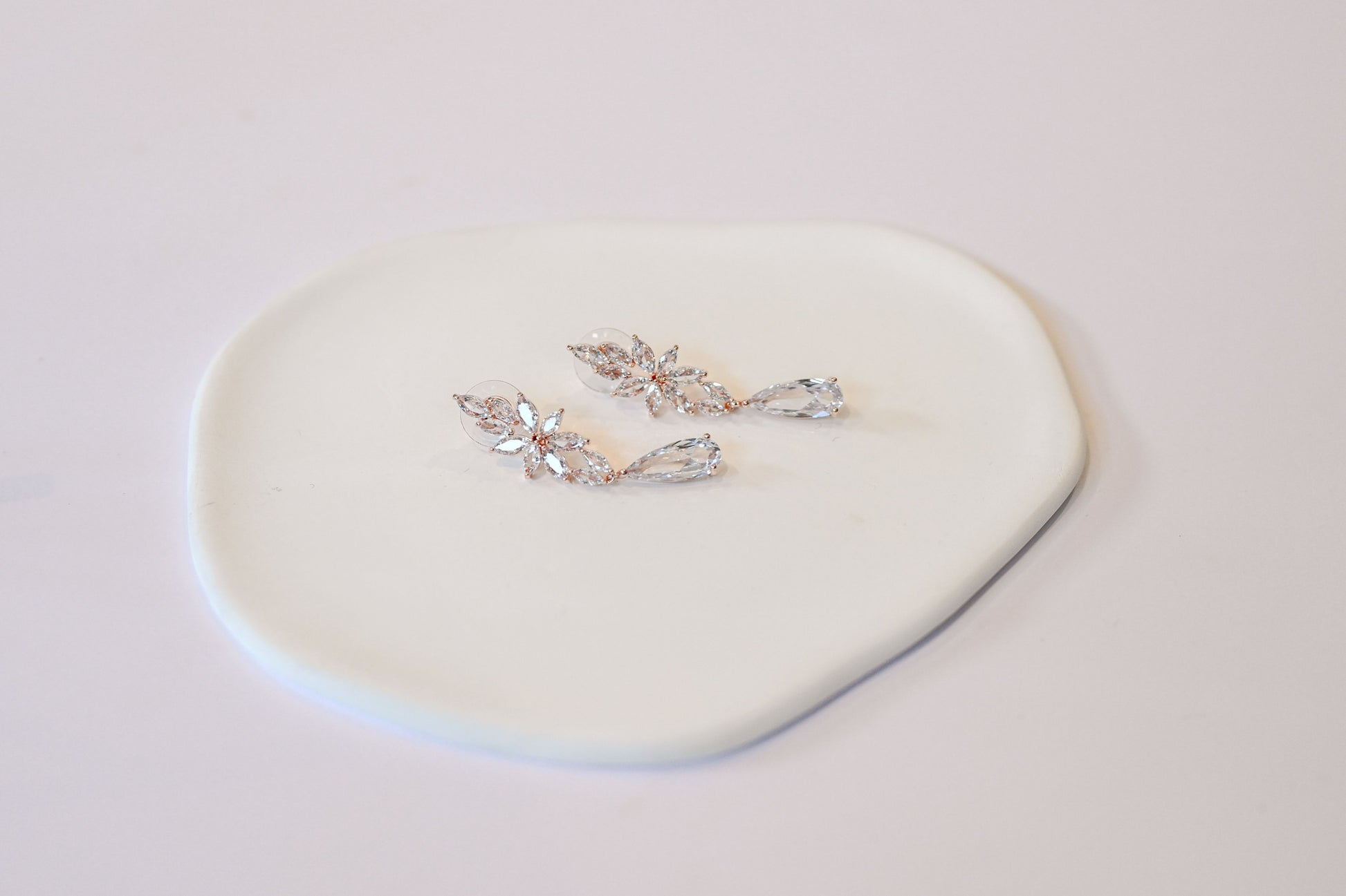 Rose gold cubic zirconia dangling bridal earrings