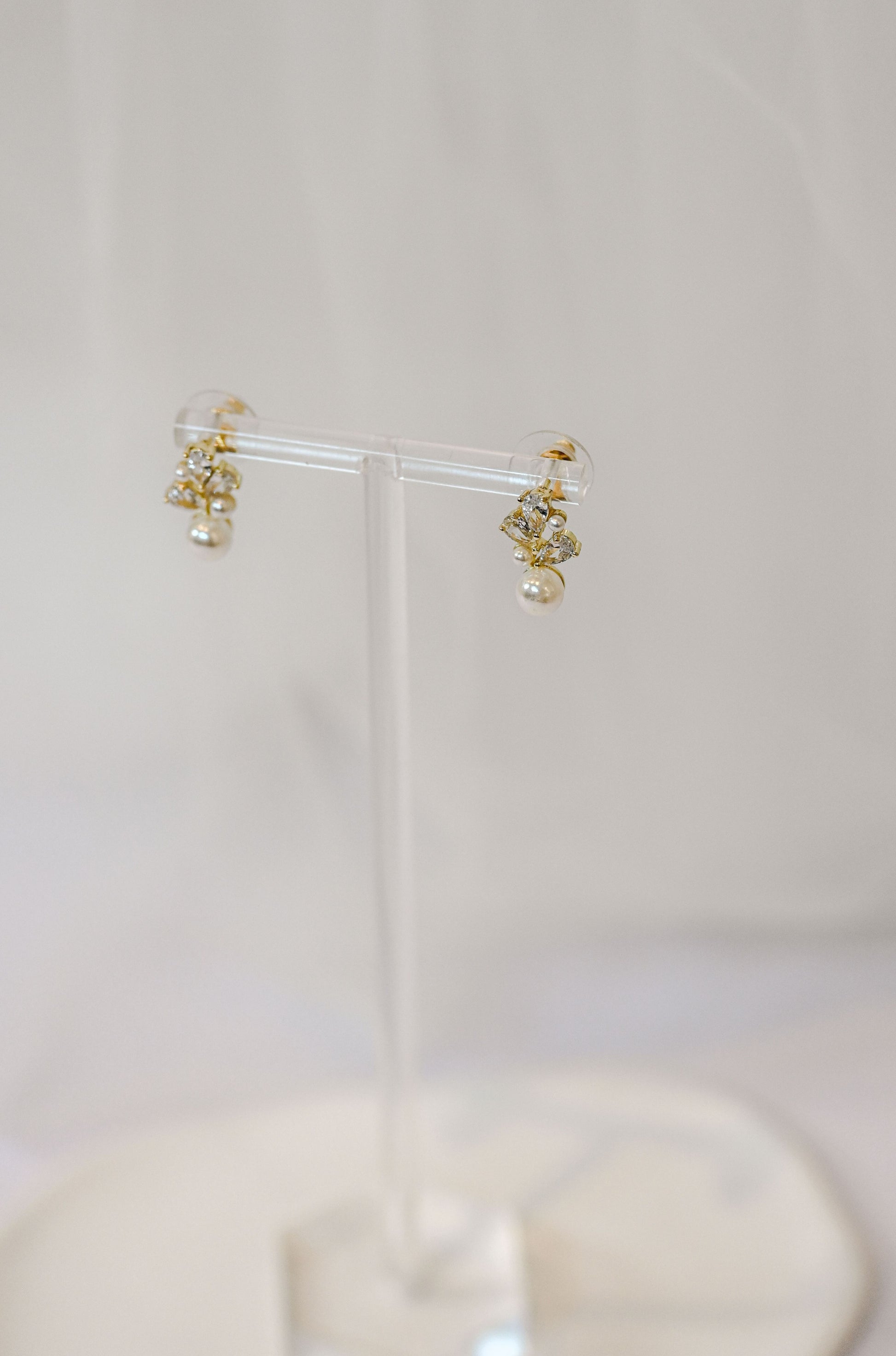Dainty gold bridal stud earring with cubic zirconia and pearls